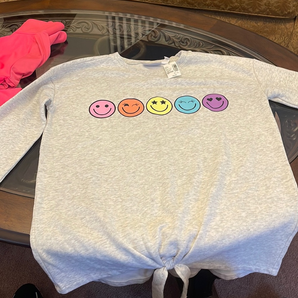 Girl sweatshirt…never worn…still has tags..light sweatshirt material